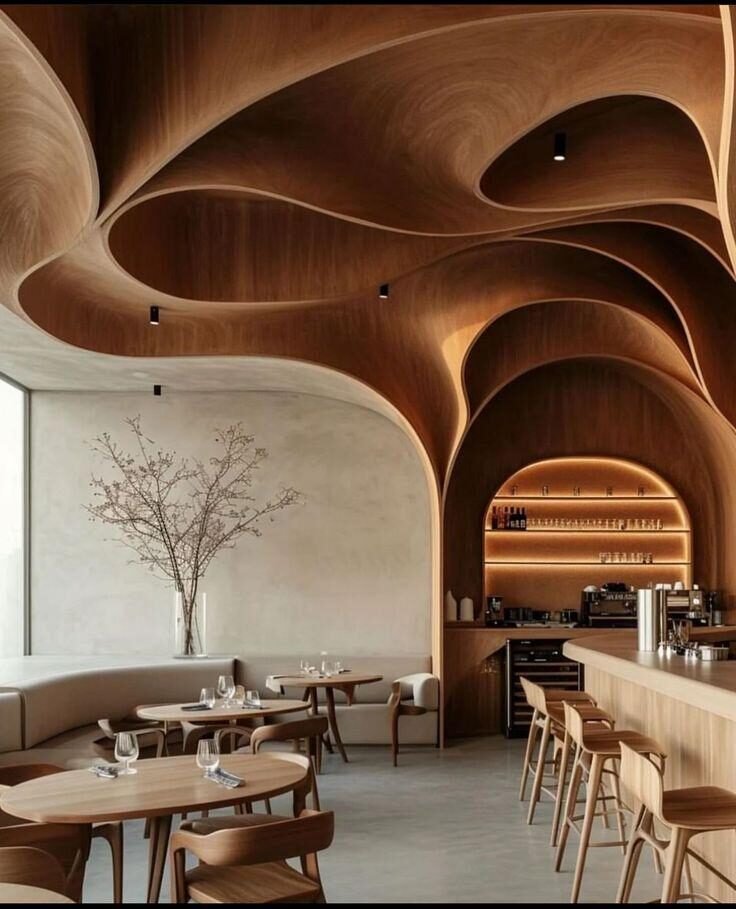 Curved wooden ceiling above a restaurant dining area