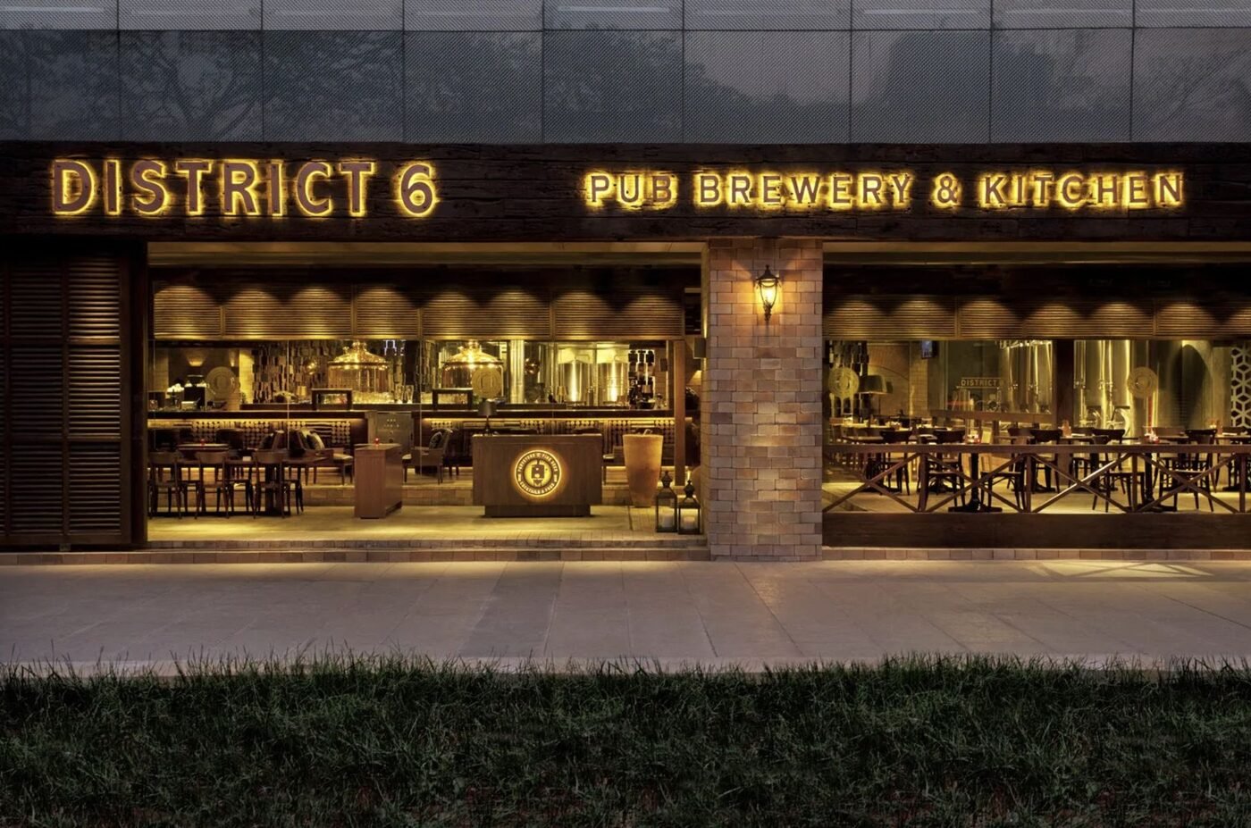 District 6 copper brewing stills at the bar