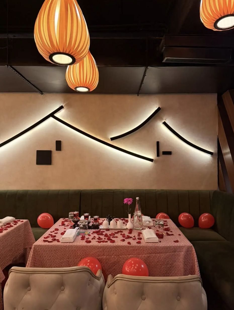 Papaya restaurant dining area with geometric lighting